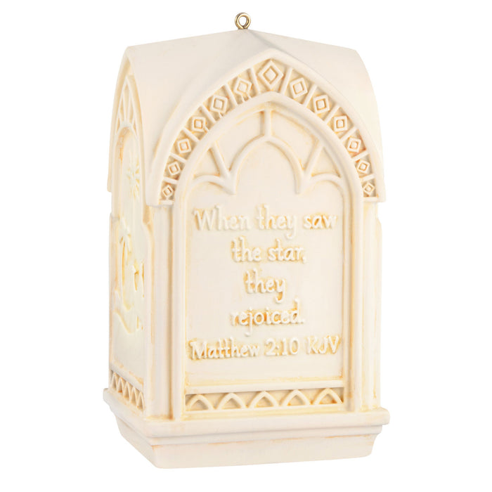 Decorative ornament with engraved text on a white background