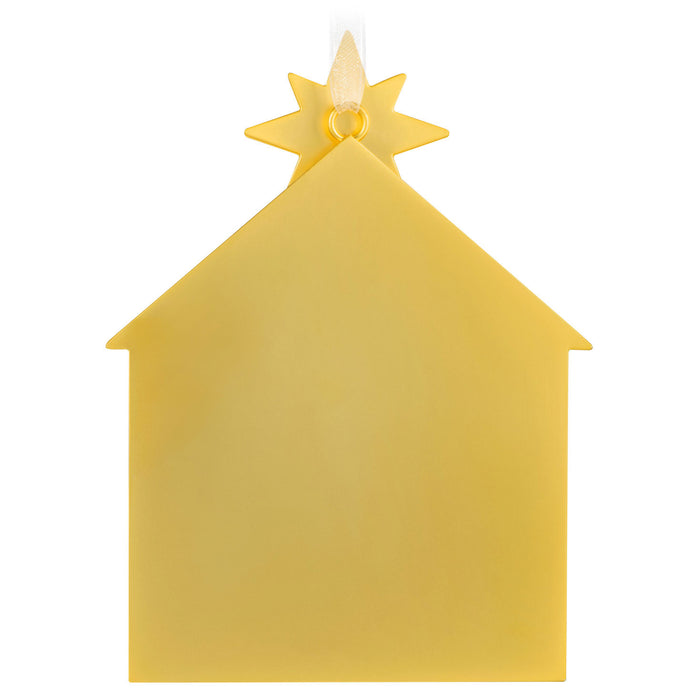 Yellow house-shaped cut out with a star on top against a white background