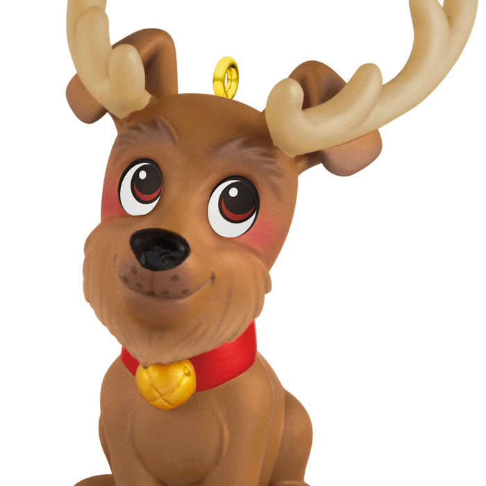 Dog reindeer figure with large eyes and a red collar on a white background