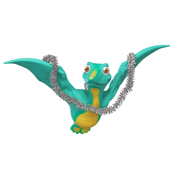 Dinosaur figure with a silver tinsel on a white background