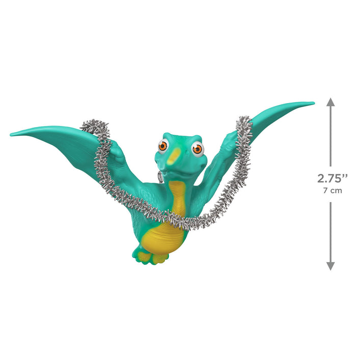 Dinosaur figure with a silver tinsel with a measurement label on a white background