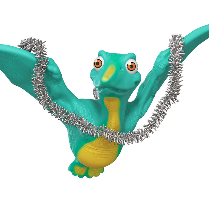 Dinosaur figure with a silver tinsel on a white background