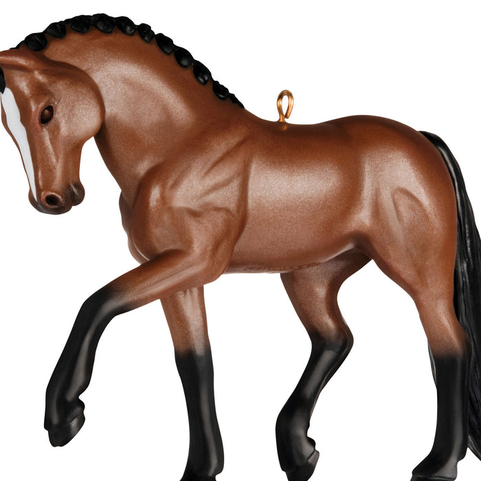 Brown horse figurine with black mane on a white background
