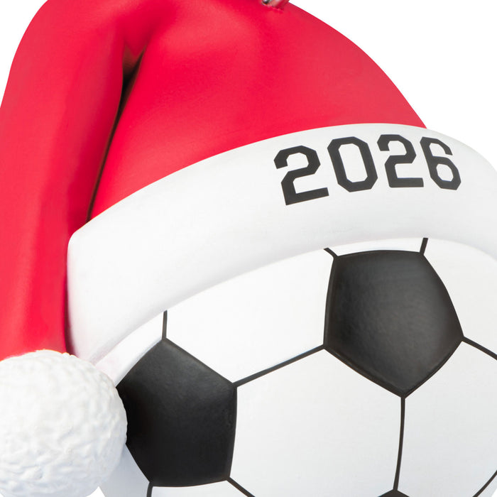 Soccer ball with a Santa hat featuring '2026' on a white background