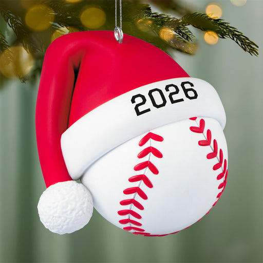 Baseball ornament with a Santa hat and '2026' on a Christmas tree background