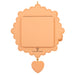 Peach-colored decorative item with scalloped edge and heart charm on a white background