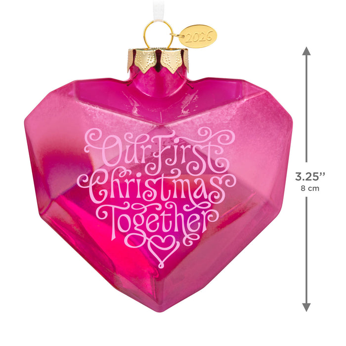 Pink heart-shaped ornament with 'Our First Christmas Together' text and gold cap, with dimensions indicated.