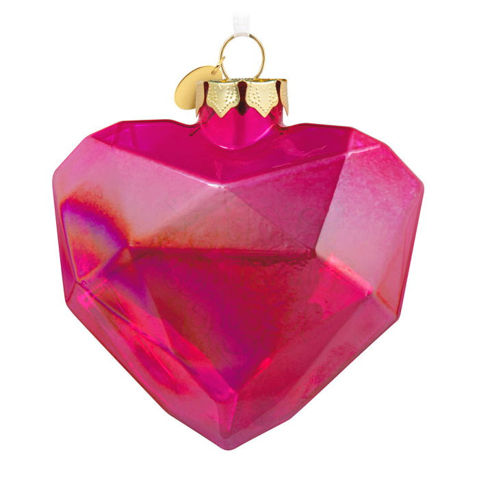 Pink heart-shaped ornament on a white background