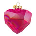 Pink heart-shaped ornament on a white background