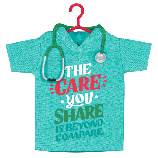 Turquoise scrub top with stethoscope on a red hanger against a white background