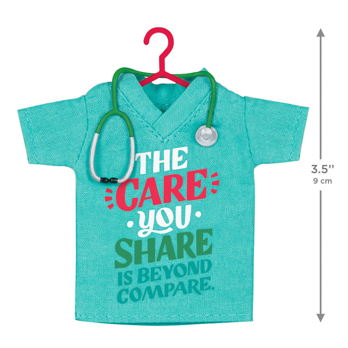 Turquoise shirt with stethoscope and text on a white background