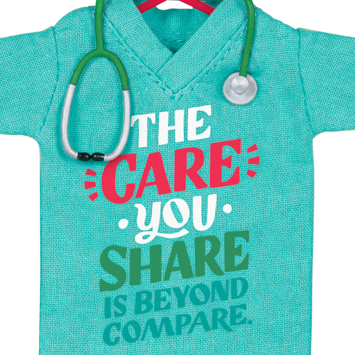 Turquoise hoodie with a stethoscope, featuring motivational text on a white background