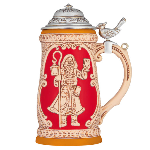 Decorative beer stein with intricate designs on a white background