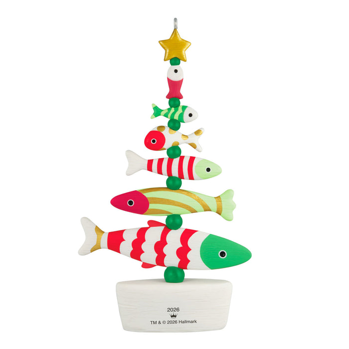 Colorful fish-shaped Christmas tree ornament on a white background