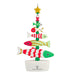 Colorful fish-shaped Christmas tree ornament on a white background