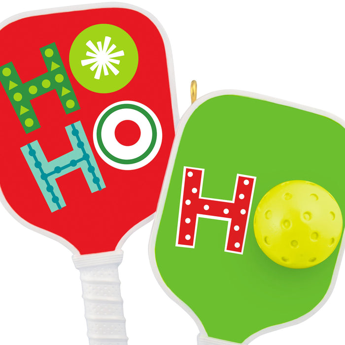 Two pickleball paddles ornament with 'HO HO' text on a white background