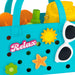 Blue beach bag with 'Relax' text, sunglasses, and beach accessories on a white background