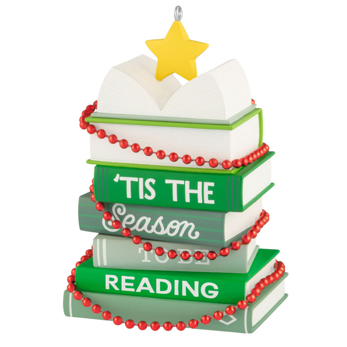Decorative ornament with books stacked and 'Tis the Season to be Reading text, on a white background.