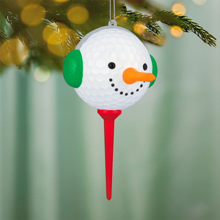 Christmas ornament shaped like a snowman with a red stand, hanging on a decorated tree.