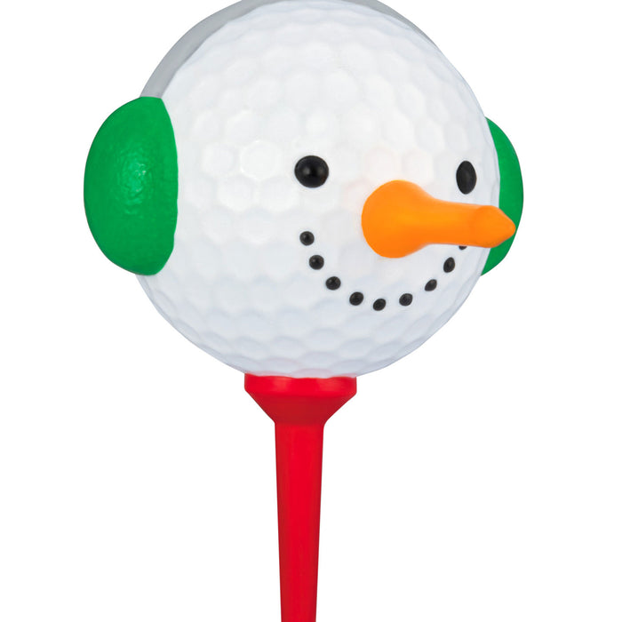 Golf ball with a snowman face on a red tee against a white background