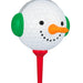 Golf ball with a snowman face on a red tee against a white background