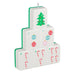 Stack of Christmas-themed dice with tree, ornaments, and candy cane designs on a white background.