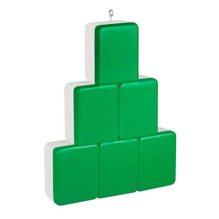 Green plastic blocks stacked in a pyramid shape on a white background