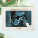 Christmas ornament with ultrasound image and '2026' on a white background