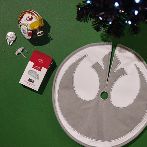 Star Wars-themed tree skirt with decorative items on a green surface
