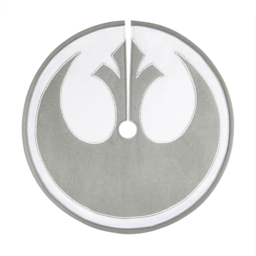 Metallic emblem with a central design on a white background