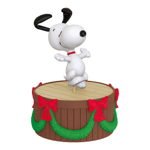 Animated character on a wooden barrel with red bows and green garland