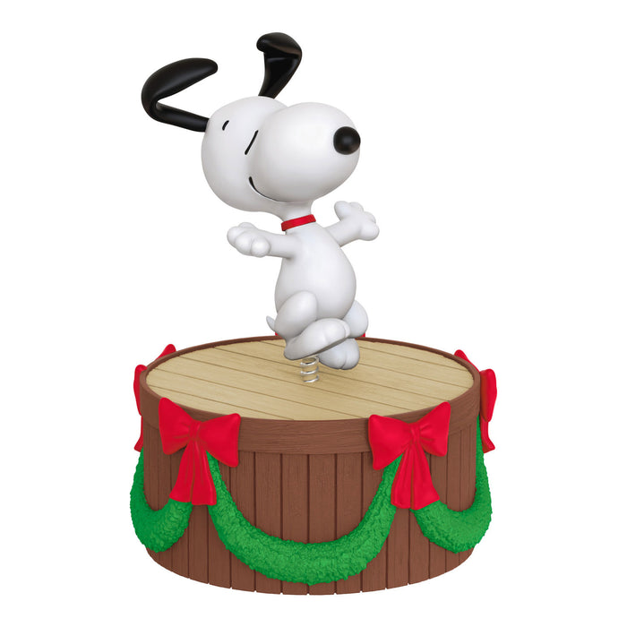 Animated character on a wooden barrel with red bows and green garland
