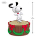 Snoopy figurine on a wooden barrel with red bows and green garland, mini size, on a white background.