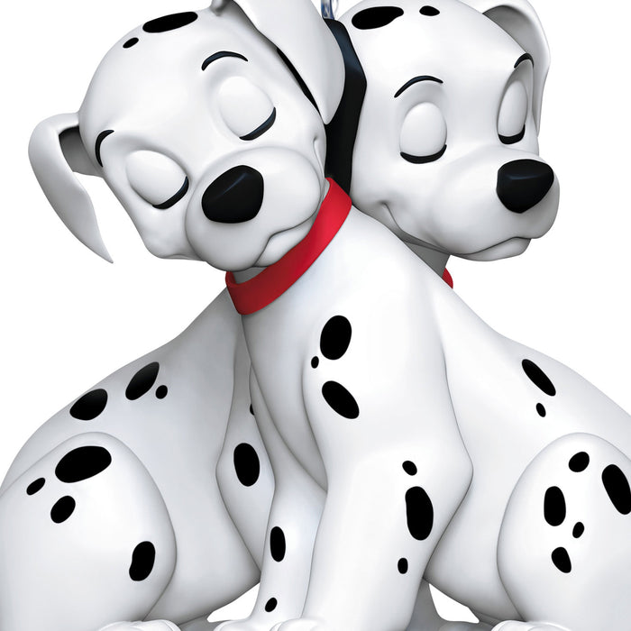 Two cartoon Dalmatian dogs with black spots on a white background