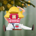 Decorative ornament of a character with yellow hair and pink headgear hanging from a tree.