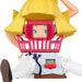 Toy figure of a character with a yellow hat and pink basket on a white background