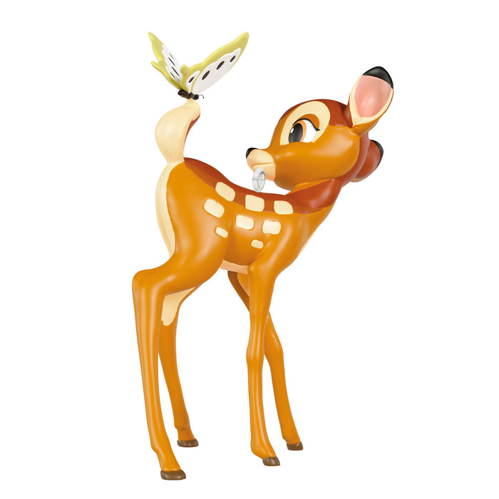 Deer figurine with white spots on a white background