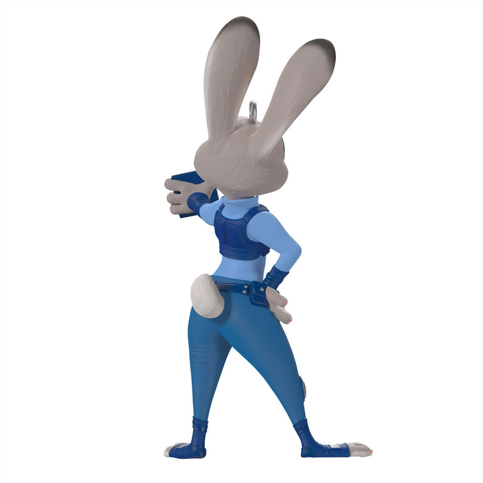 Animated character figure in blue outfit with gun on white background