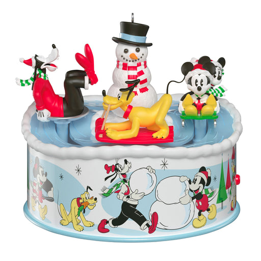 Decorative cake with animated characters including a snowman and dogs on a white background