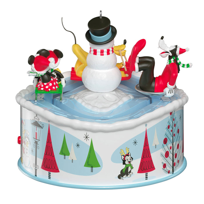 Christmas-themed music box with animated characters on a white background
