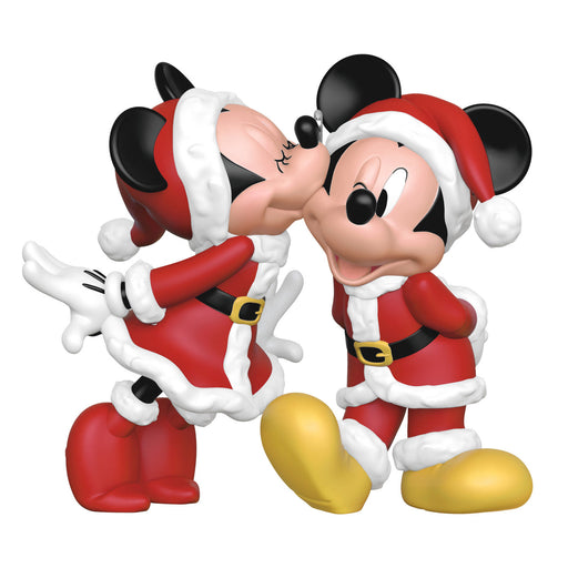 Two cartoon characters in Santa outfits on a white background