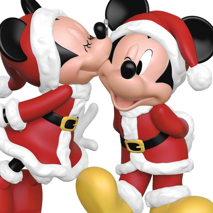 Two cartoon characters in Santa Claus outfits embracing each other.