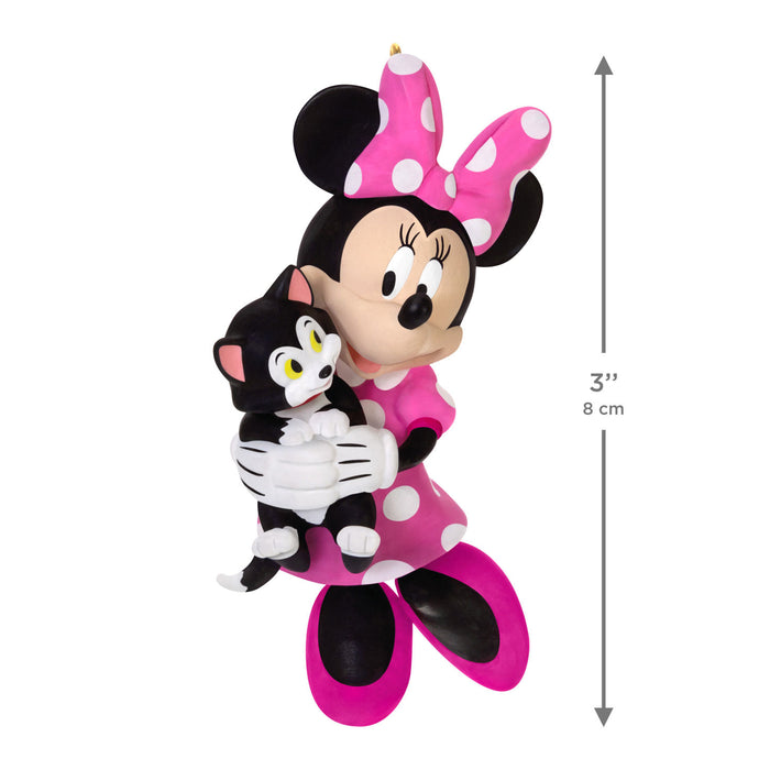 Minnie Mouse figurine holding a black and white cat with dimensions indicated.