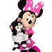 Plush toy of a character with a large pink bow holding a black and white cat plush toy on a white background