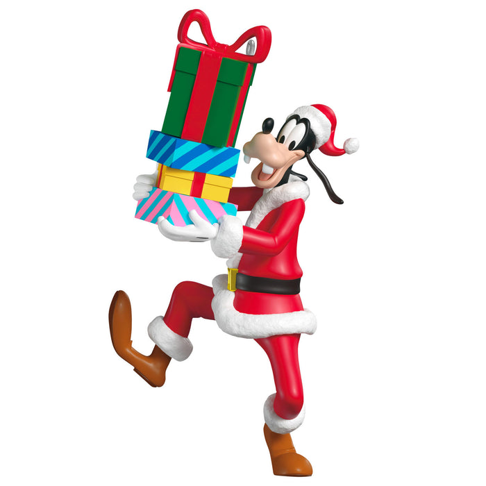 Animated character in Santa Claus outfit holding a stack of colorful gifts on a white background