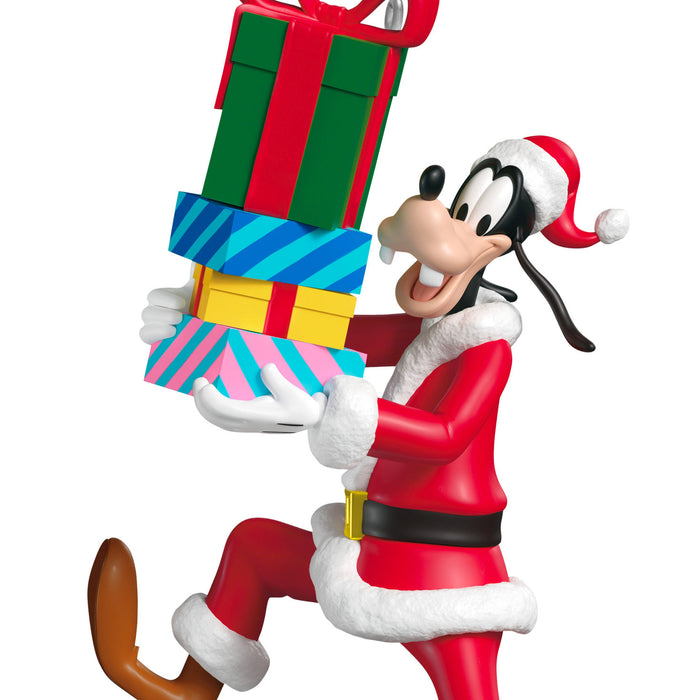 Animated character in Santa Claus outfit holding colorful gifts on a white background