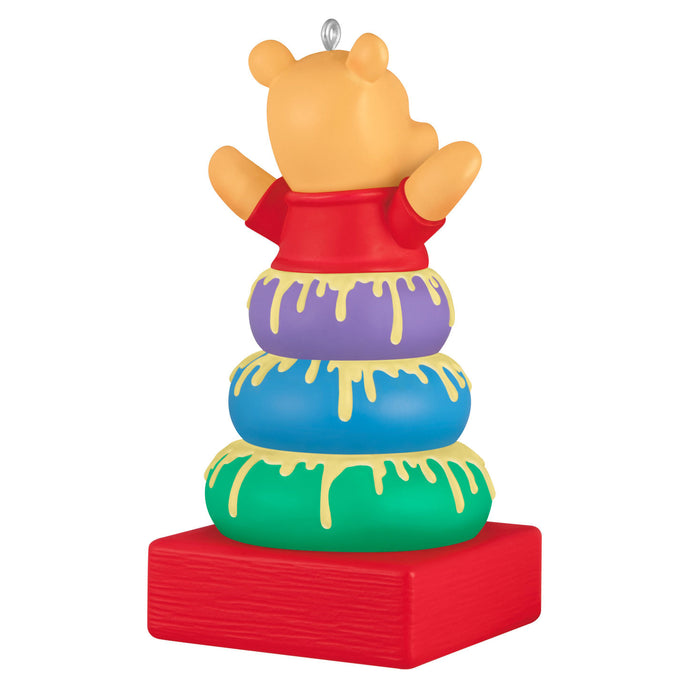 Decorative ornament of a bear character with colorful rings on a white background