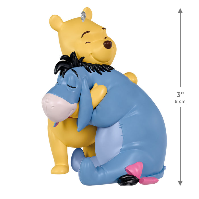 Figurine of a Winnie-the-Pooh and Eeyore hugging with a measurement indicator on a white background