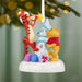 Christmas ornament featuring Winnie the Pooh and Tigger with a white tree on a green background.