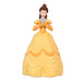 Candle shaped like a character in a yellow dress on a white background